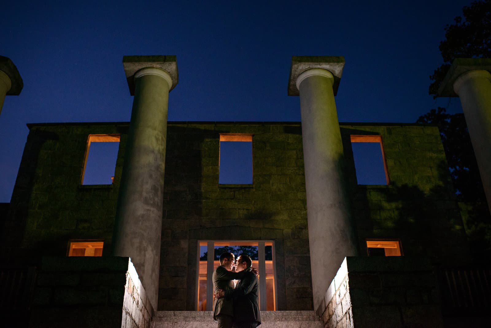 A couple silhouetted against the last light of the evening