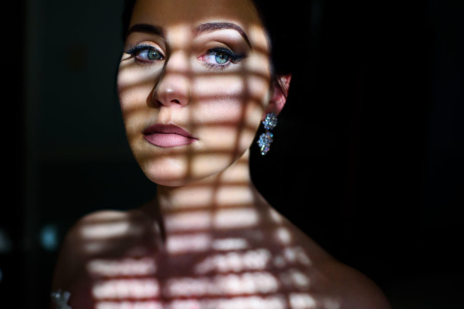 A bride in dramatic window light